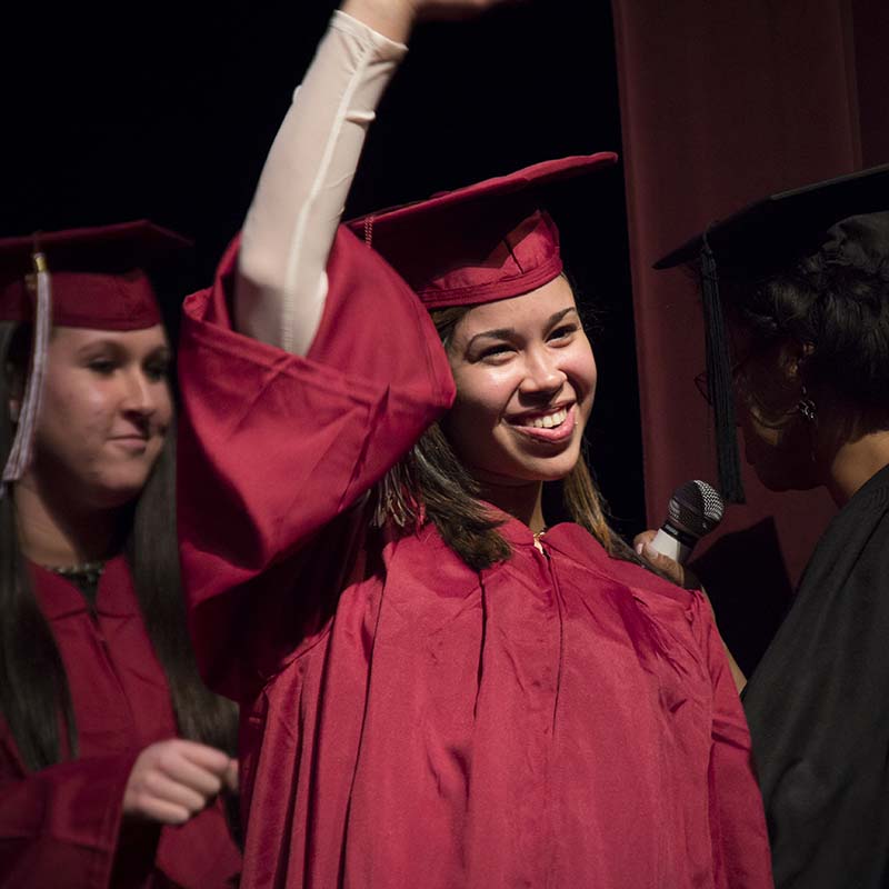 Student waving her hand